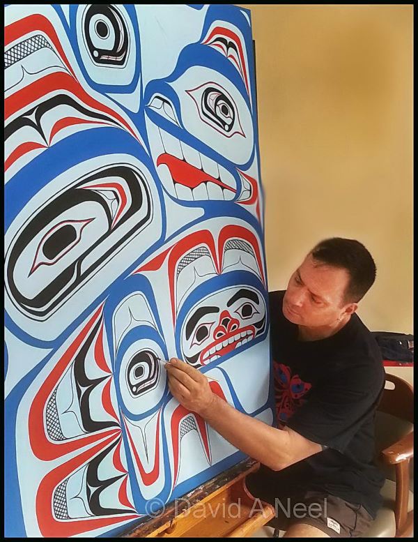 David Neel finishing a traditional kwakiutl painting